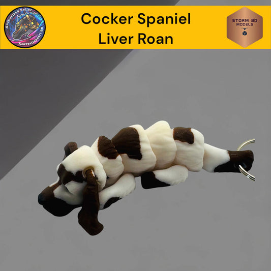 Cocker Spaniel toy with liver roan coloration on a gray background
